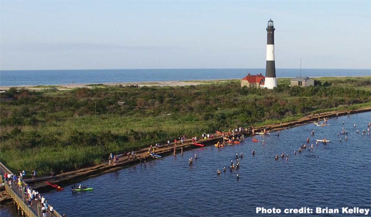 Swimmers entering the water at the start of the Cross Bay Swim